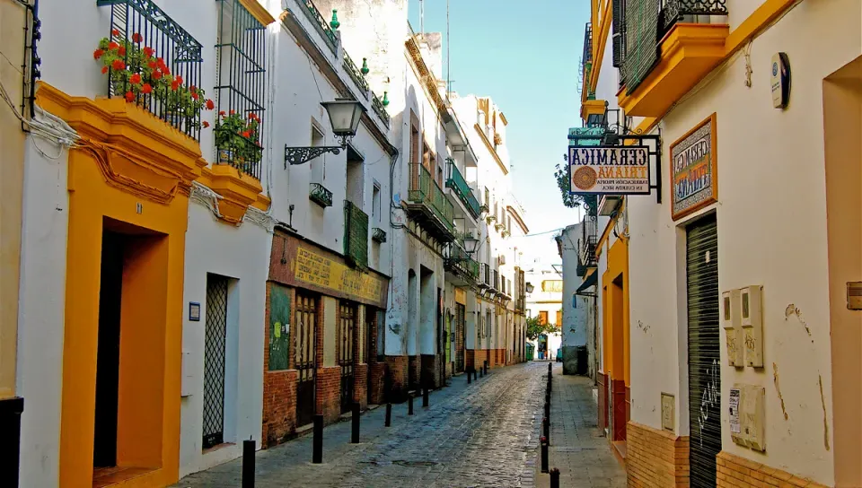 A street view with white and yellow buildings